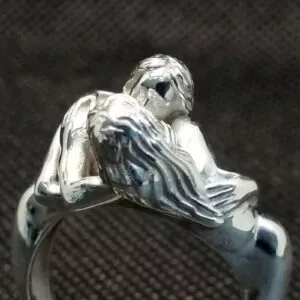 Nude women couple kissing ring