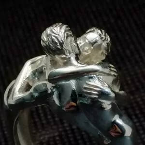 Nude male couple kiss ring